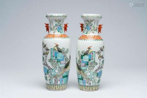 A pair of Chinese famille rose vases with birds among blosso...