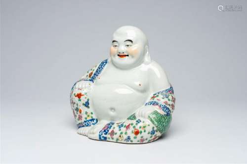 A Chinese famille rose figure of a seated and laughing Buddh...