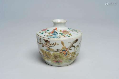 A Chinese famille rose bowl and cover with a phenix, butterf...
