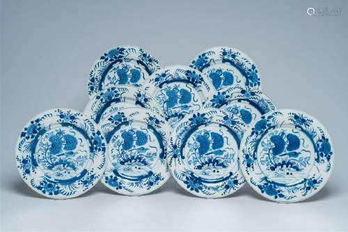 Nine Chinese blue and white plates with a bird among blossom...