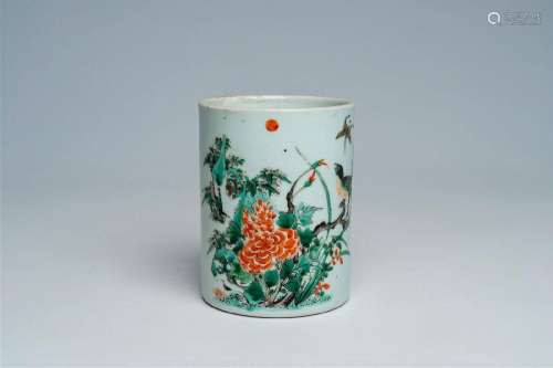 A Chinese famille verte brush pot with a bird and a butterfl...