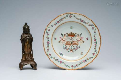A Chinese famille rose armorial plate and a bronze figure of...
