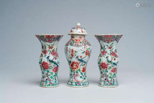 A Chinese famille rose three-piece vase garniture with a bir...