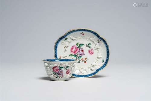 A Chinese famille rose cup and saucer with relief design of ...