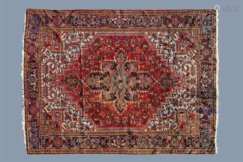 A Persian Heriz rug with floral design, wool on cotton, firs...