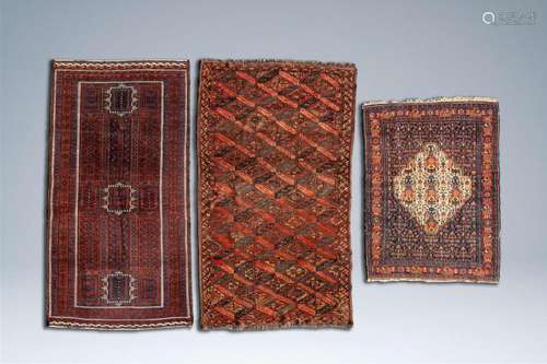 Three various Oriental rugs with geometric patterns and flor...