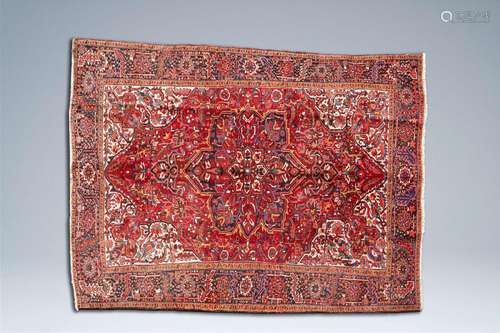 An Oriental rug with floral design, wool on cotton, probably...