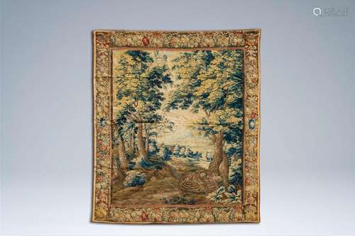 A Flemish wall tapestry with a bird of prey and a rooster, 1...