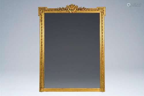 A large French Louis XVI style gilt wood mirror, 20th C.