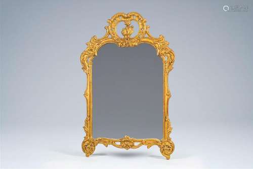 A French Louis XV style gilt wood mirror, 19th C.