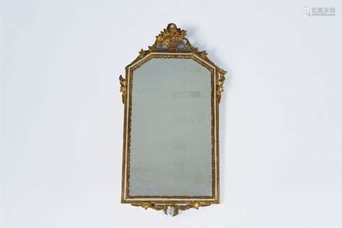 A French gilt wood mirror with floral design, 19th C.