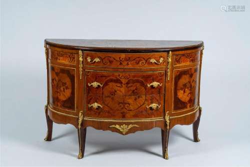 A French gilt bronze mounted marquetry half circle chest wit...