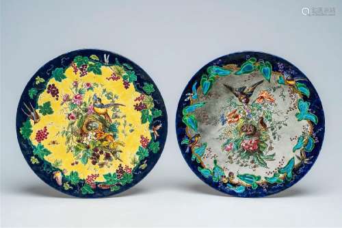 Two French polychrome faience plates with birds near their n...