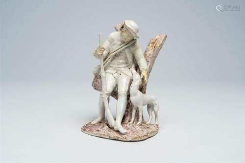 A polychrome French earthenware group with a hunter and his ...