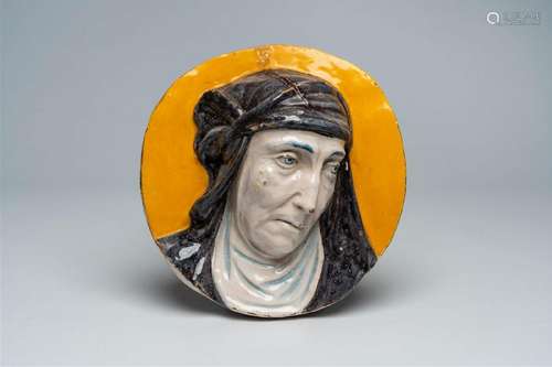 A polychrome Italian pottery portrait medallion, 19th C.