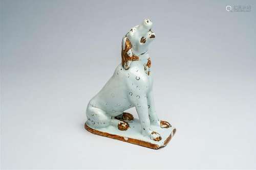 A cold-painted Brussels faience model of a dog, 18th C.