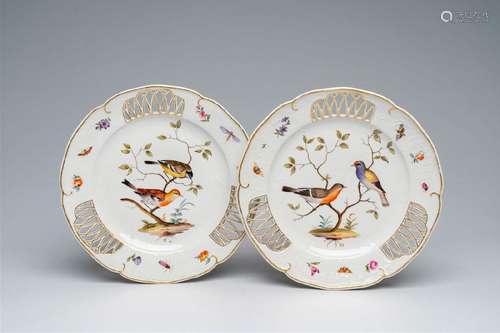 A pair of German Meissen polychrome and gilt plates with bir...