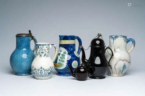 A varied collection of pottery ewers incl. Brussels, Rouen a...