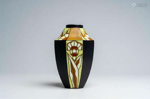 An octagonal Boch Keramis Art Deco vase with polychrome flor...