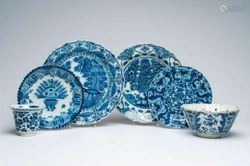 Two Dutch Delft bowls, two plates and two chargers with flor...