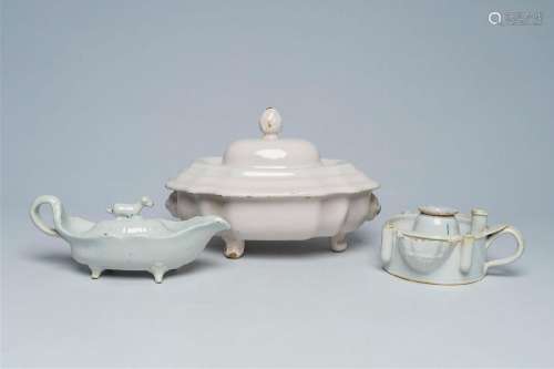 A white Delftware sauceboat, a tureen and cover and an inkwe...