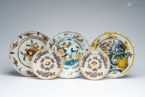 Three Dutch Delft polychrome chargers and two plates with fl...