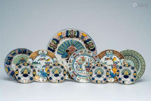 A Dutch Delft polychrome charger, five plates and four sauce...