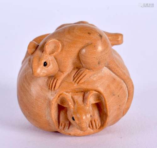 A CONTEMPORARY CARVED BOXWOOD NETSUKE modelled overlaid with...
