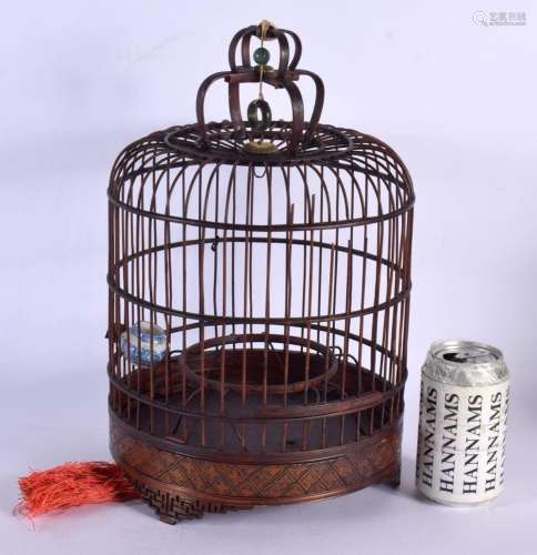 A LARGE CHINESE REPUBLICAN PERIOD CARVED BAMBOO BIRD CAGE wi...