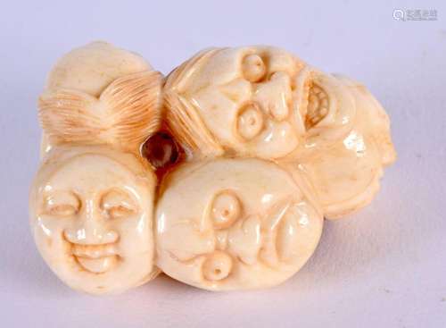 A JAPANESE CARVED MASK HEAD NETSUKE. 5 cm x 3.5 cm.