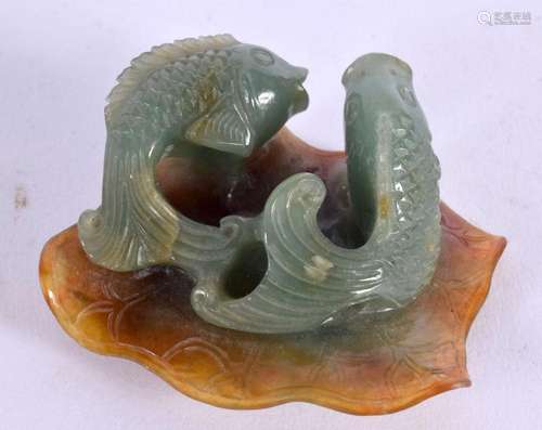 AN EARLY 20TH CENTURY CHINESE CARVED JADEITE FISH GROUP Late...