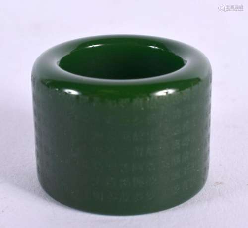 A CHINESE CARVED GREEN JADE ARCHERS RING 20th Century. 3.5 c...
