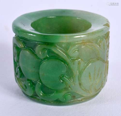 A CHINESE CARVED JADEITE ARCHERS RING 20th Century. 4 cm wid...