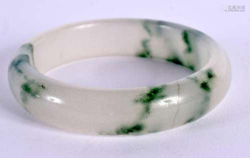 A CHINESE JADE BANGLE 20th Century. 7 cm diameter.