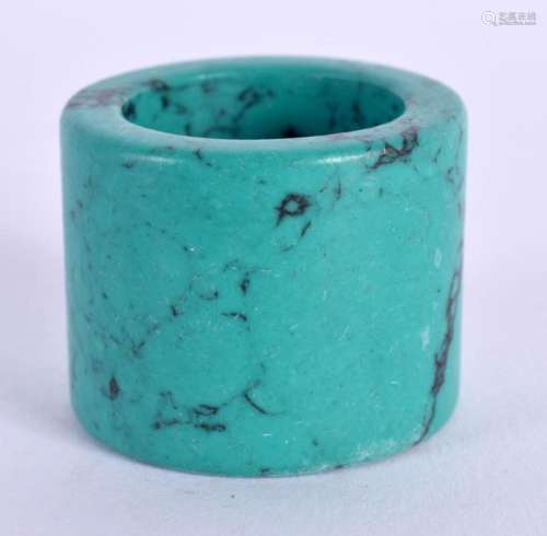 A CHINESE CARVED TURQUOISE ARCHERS RING 20th Century. 4 cm w...