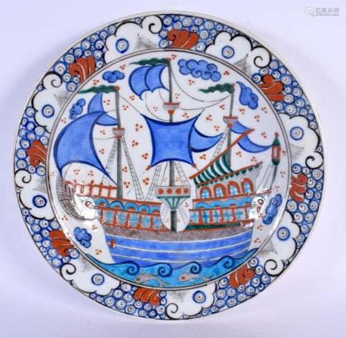 A TURKISH ISLAMIC FAIENCE DISH painted with boats. 32 cm dia...