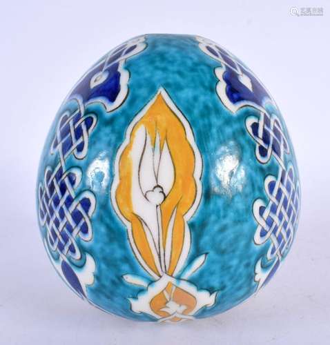 AN UNUSUAL TURKISH FAIENCE KUTAHYA HANGING BALL. 14 cm x 9 c...