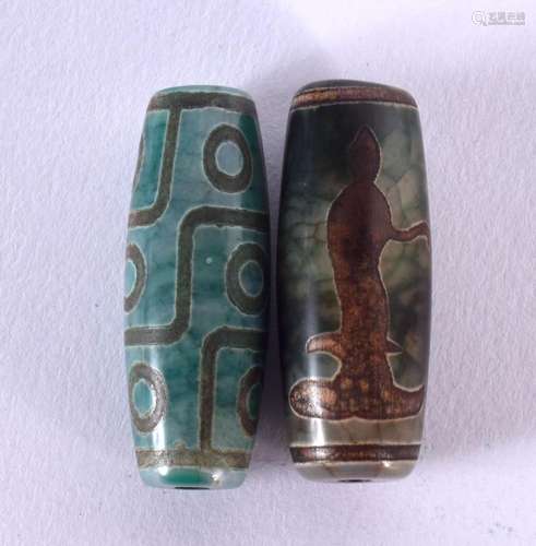 TWO CHINESE TIBETAN AGATE ZHU BEADS. 4 cm long. (2)