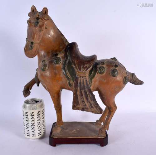 A CHINESE QING DYNASTY POTTERY FIGURE OF A HORSE Tang style....