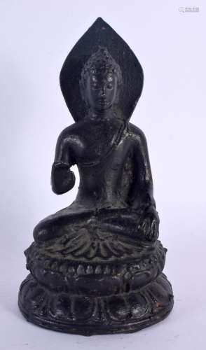 AN EARLY 20TH CENTURY SOUTH EAST ASIAN BUDDHA modelled with ...