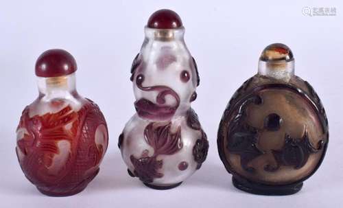 THREE 19TH CENTURY CHINESE PEKING GLASS SNUFF BOTTLES. Large...