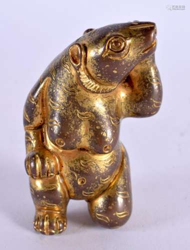 A CHINESE QING DYNASTY GILT BRONZE SCROLL WEIGHT formed as a...