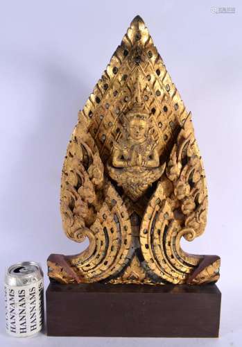 A LARGE THAI GILTWOOD SCULPTURE OF A BUDDHISTIC DEITY modell...
