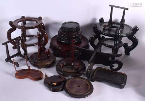 A GROUP OF CHINESE HARDWOOD STANDS in various forms and size...