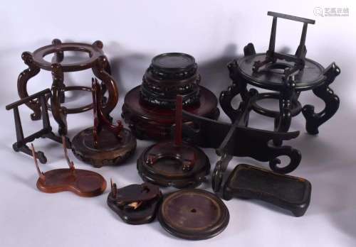A GROUP OF CHINESE HARDWOOD STANDS in various forms and size...