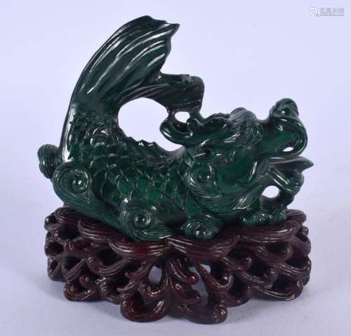 AN EARLY 20TH CENTURY CHINESE CARVED MALACHITE FIGURE OF A B...