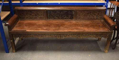 A 19TH CENTURY CHINESE CARVED HARDWOOD BENCH Qing, decorated...