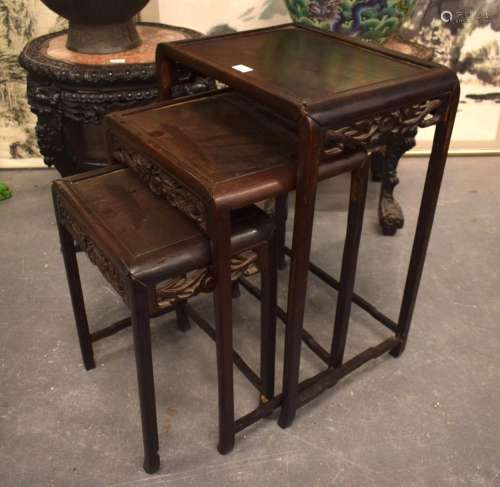 A NEST OF THREE 19TH CENTURY CHINESE HARDWOOD TABLES. Larges...