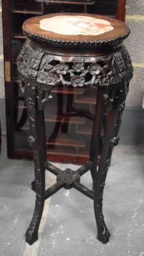A 19TH CENTURY CHINESE HARDWOOD MARBLE INSET HARDWOOD STAND....