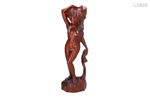A Balinese carved wooden sculpture depicting bathing lady. T...
